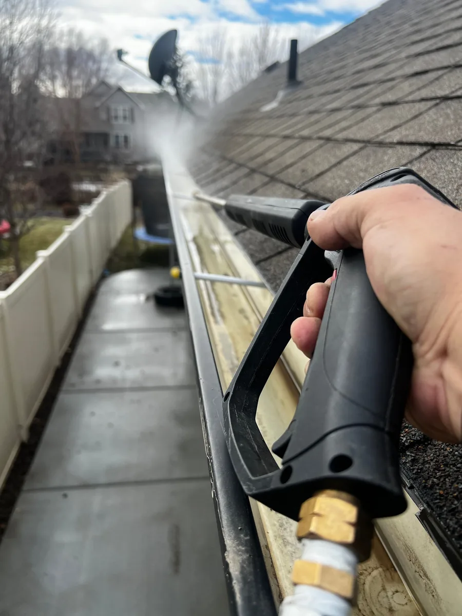 Gutter exterior being cleaned
